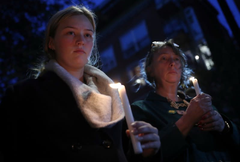 Anti-racism campaigners take part in a vigil, following the discovery of 39 bodies in a truck container, outside the Home Office in London