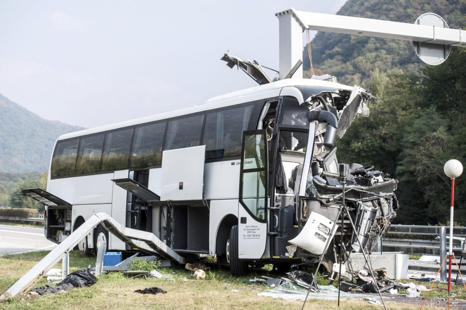 The accident site of a bus that crashed into signal post on the highway A2 in Sigirino, canton of Ticino, Switzerland, Sunday, Oct. 14, 2018. The A2 highway between Rivera and Lugano-North in is closed to the south. Several people were injured in the accident. (Gabriele Putzu, Ti-Press/Keystone via AP)