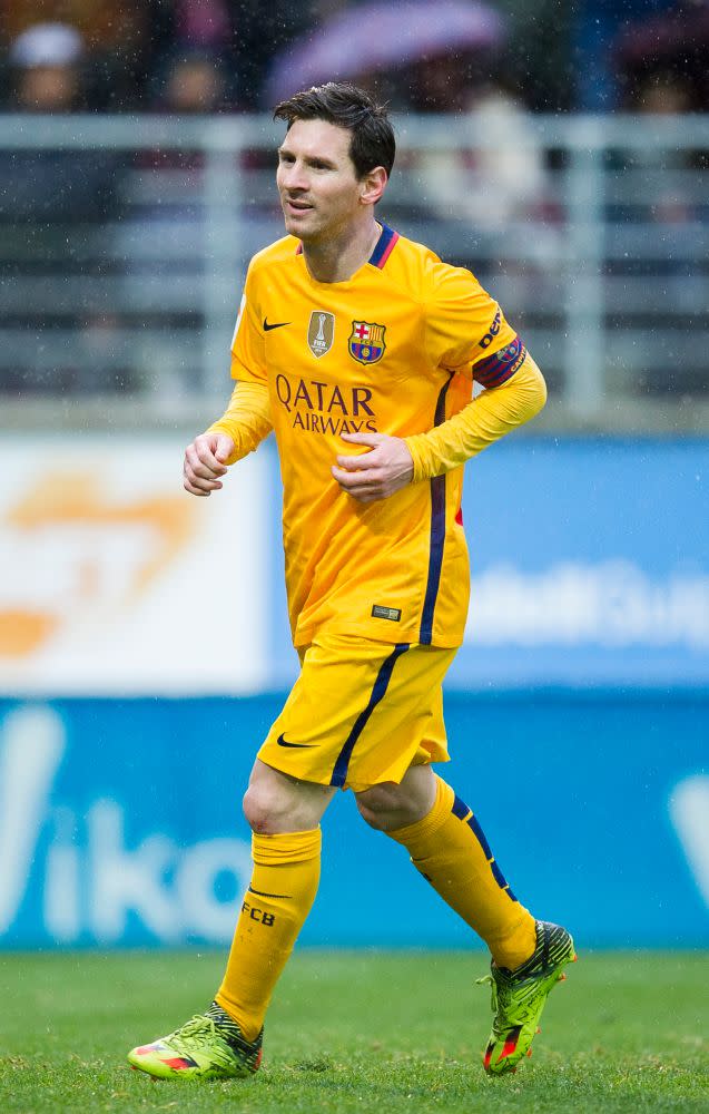 <p>Lionel Messi celebrates after scoring his team’s third goal during the La Liga match between SD Eibar and FC Barcelona at Ipurua Municipal Stadium on March 6, 2016 in Eibar, Spain. The athlete wore a pair of lime green cleats with orange and black accents. </p>