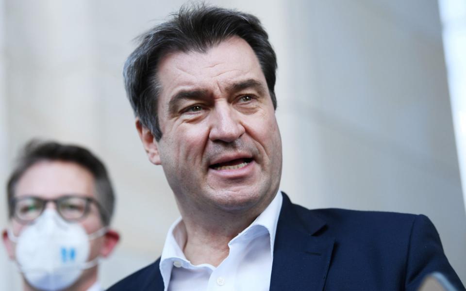 Bavarian State Premier and a leader of the Bavarian Christian Social Union (CSU) Markus Soder speaks to the media as he leaves after a CDU/CSU fraction meeting in Berlin, Germany April 13, 2021. REUTERS/Annegret Hilse - ANNEGRET HILSE/ REUTERS