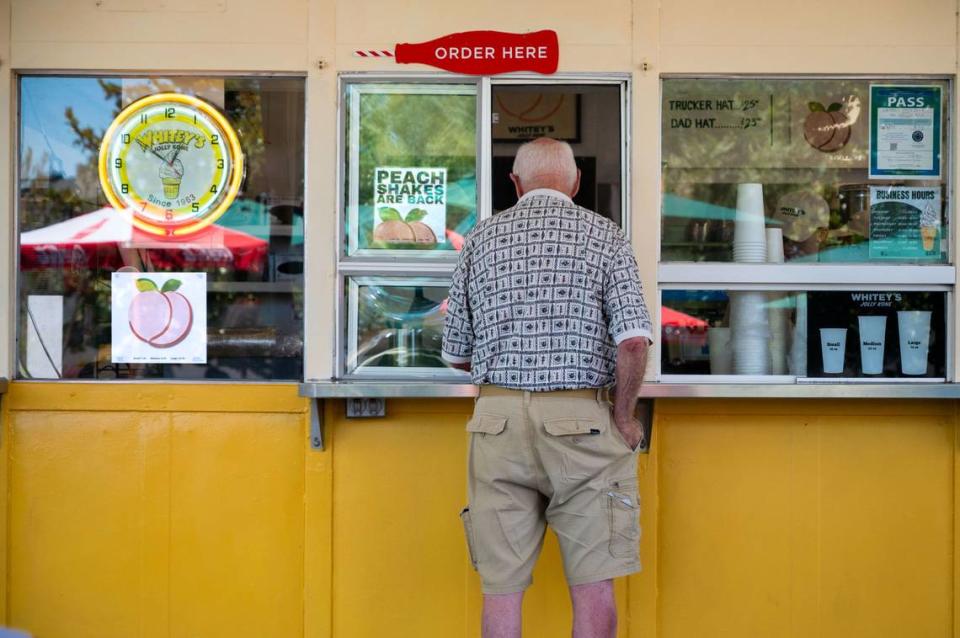 A customer orders at Whitey’s Jolly Kone in West Sacramento on Tuesday.