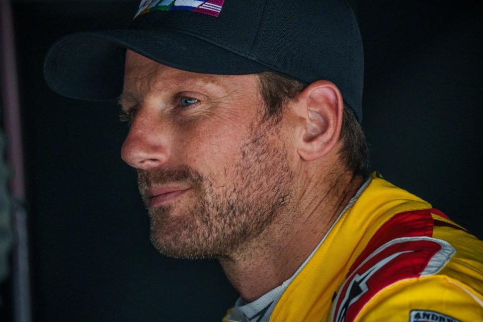 Andretti Autosport driver Romain Grosjean (28) sits in and watches various screens with team members Friday, May 20, 2022, during Fast Friday practice in preparation for the 106th running of the Indianapolis 500 ta Indianapolis Motor Speedway.