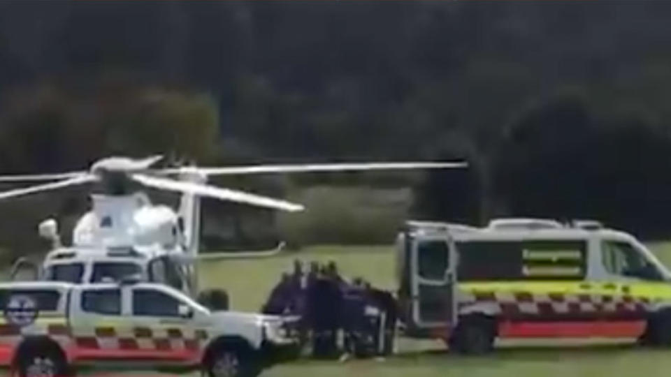 The keeper is seen being loaded into an ambulance helicopter. Source: Nine News