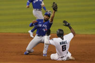 Toronto Blue Jays shortstop Marcus Semien, left, catches the ball as Miami Marlins' Starling Marte, right, is late stealing second base during the ninth inning of a baseball game, Tuesday, June 22, 2021, in Miami. The Blue Jays defeated the Marlins 2-1.(AP Photo/Marta Lavandier)