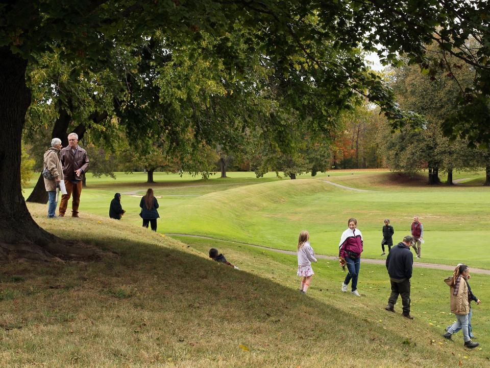 Visitors climb Observatory Mound at the Octagon Earthworks after a tour Oct. 15. The Ohio History Connection held events at the Great Circle and Octagon Earthworks to celebrate their designation as UNESCO World Heritage Sites.