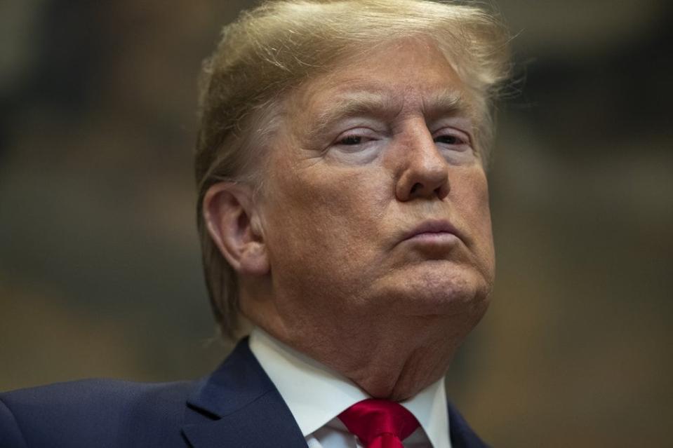 In this Jan. 9, 2020, file photo President Donald Trump listens as Secretary of the Interior David Bernhardt delivers remarks on proposed changes to the National Environmental Policy Act, at the White House in Washington. (AP Photo/ Evan Vucci, File)