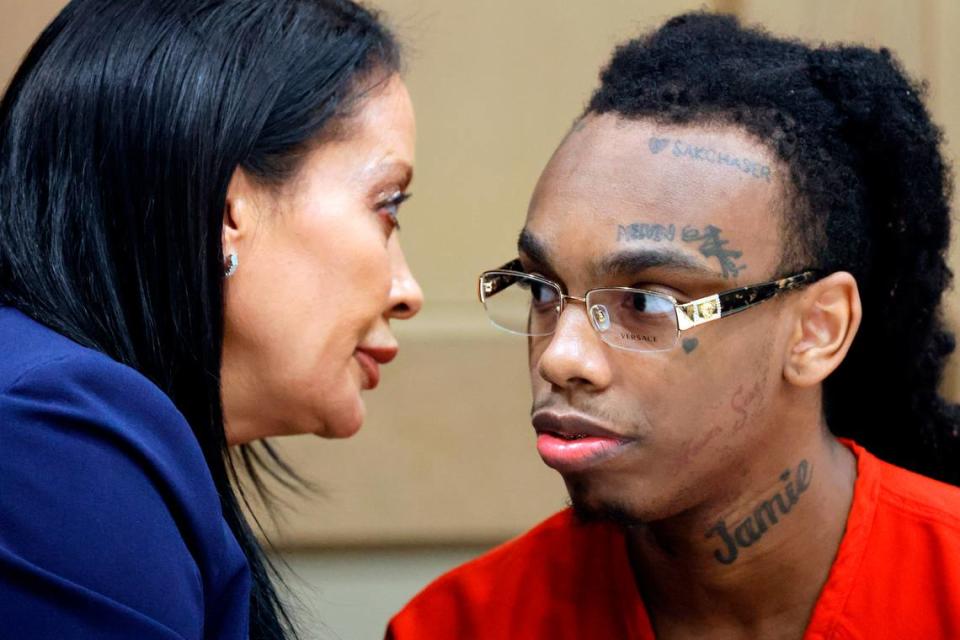 Jamell Demons, better known as rapper YNW Melly, speaks with defense attorney Raven Ramona Liberty during a hearing before his trial at the Broward County Courthouse in Fort Lauderdale on Friday, Oct. 13, 2023. Demons is accused of killing two fellow rappers and conspiring to make it look like a drive-by shooting in October 2018.