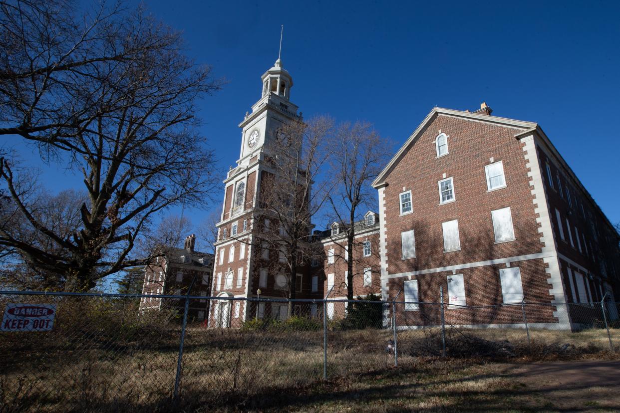 Kansas Gov. Laura Kelly signed legislation Friday providing $637,500 to the group that plans to turn Topeka's iconic Menninger Clock Tower, shown here, into apartments.