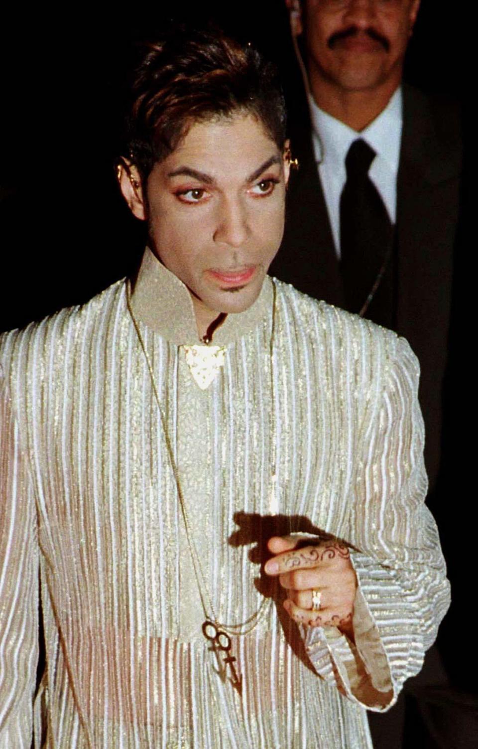 Singer-songwriter The Artist formerly known as Prince, arrives at the 10th Anniversary Essence Awards Celebration in New York, April 4. The awards show, presented by Essence Magazine, is held to recognise achievement by exceptional African Americans.