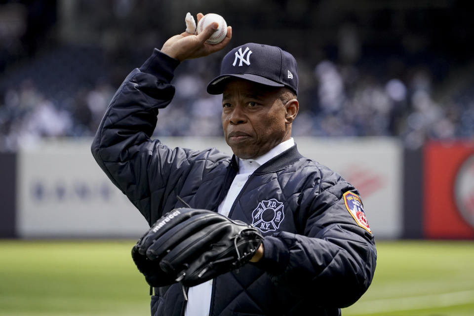 New York City Mayor Eric Adams plays catch with New York Yankees starting pitcher Luis Severino before the Yankees opening day baseball game against the Boston Red Sox, Friday, April 8, 2022, in New York. (AP Photo/John Minchillo)