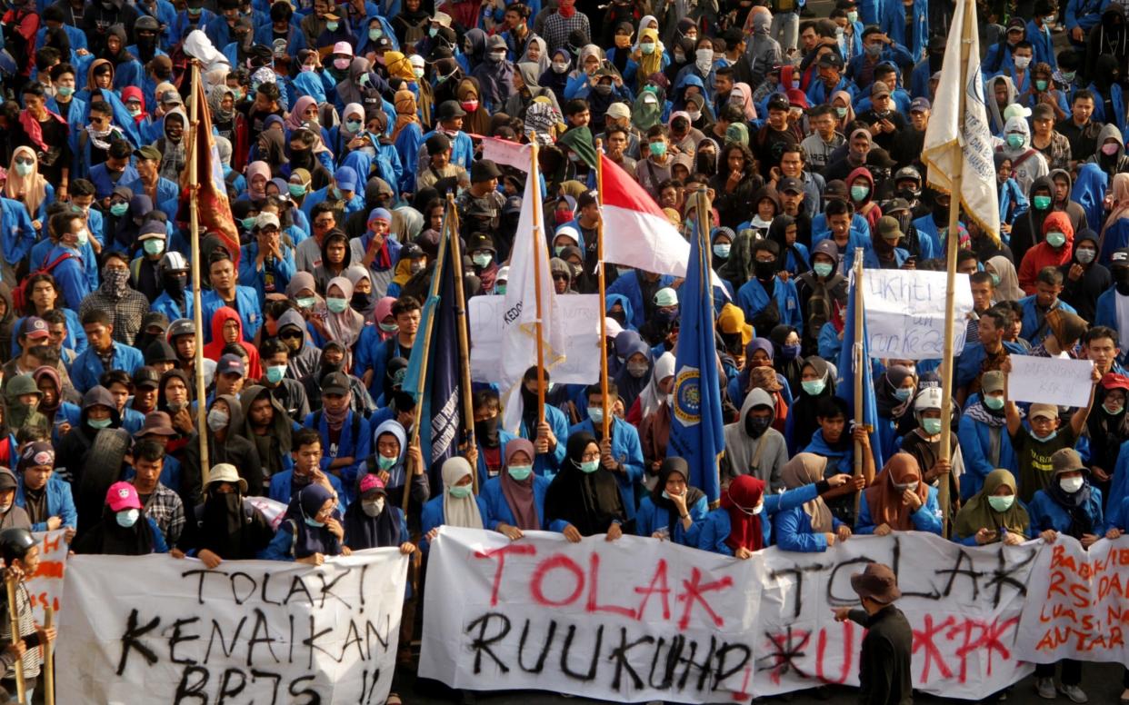 Students march towards the local parliament in Makassar, Sulawesi - REUTERS