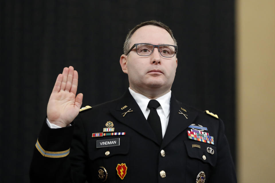 FILE - In this Nov. 19, 2019, file photo National Security Council aide Lt. Col. Alexander Vindman is sworn in to testify before the House Intelligence Committee on Capitol Hill in Washington during a public impeachment hearing of President Donald Trump's efforts to tie U.S. aid for Ukraine to investigations of his political opponents. Vindman was escorted out of the White House complex on Friday, Feb. 7, 2020, according to his lawyer. (AP Photo/Andrew Harnik, File)
