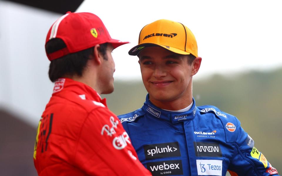 Pole position qualifier Lando Norris of Great Britain and McLaren F1 talks with second place qualifier Carlos Sainz of Spain and Ferrari in parc ferme during qualifying ahead of the F1 Grand Prix of Russia at Sochi Autodrom on September 25, 2021 in Sochi, Russi - Dan Istitene - Formula 1/Formula 1 via Getty Images