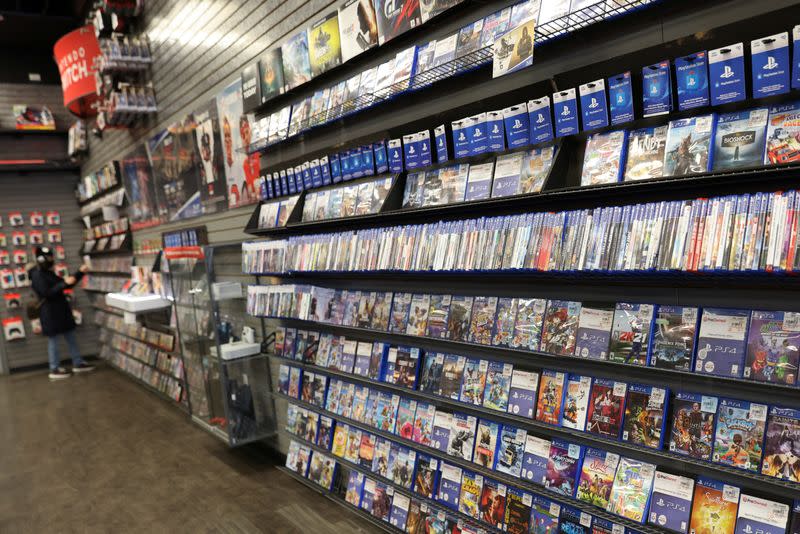 A person browses games in a GameStop in Manhattan, New York
