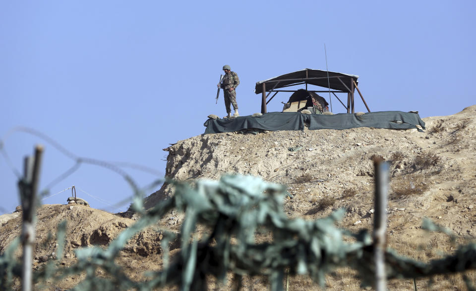 A national army soldier stands guard inside the Military Training Center in Kabul, Afghanistan, Monday, Nov. 18, 2019. Back-to-back explosions early Monday targeting the military training center wounded Afghan national army soldiers, police and interior spokesmen said. (AP Photo/Rahmat Gul)