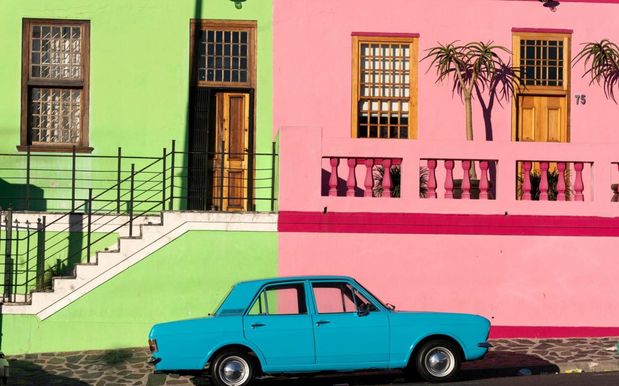  A car parked outside homes on a deserted stretch of the Cape Malay Bo-Kaap district during day 1 of a 21 day national total lockdown in Cape Town, South Africa  - SHUTTERSTOCK