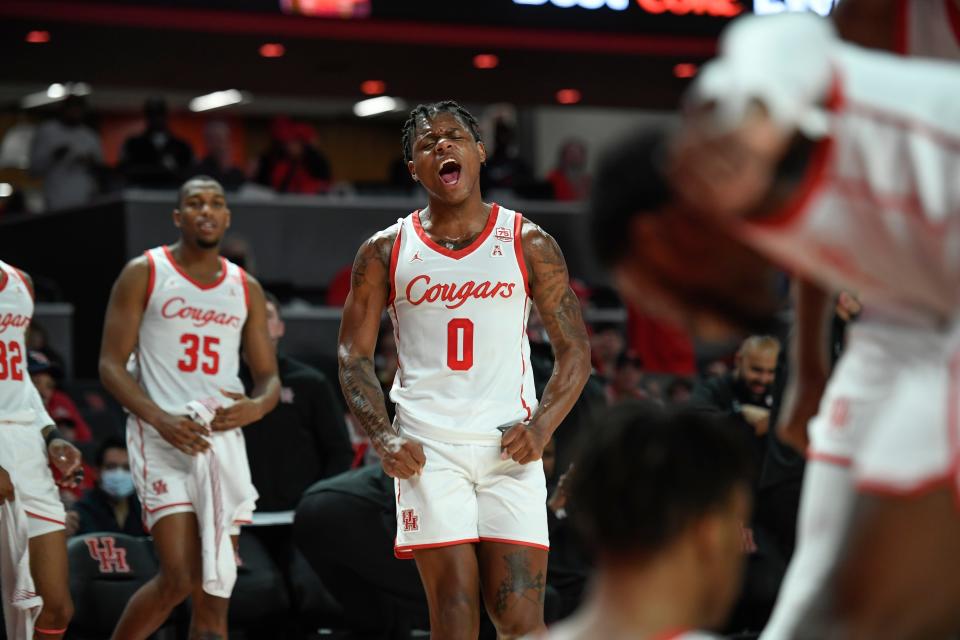 Houston guard Marcus Sasser (0) react to a foul called against Texas State during the first half of an NCAA college basketball game Wednesday, Dec. 22, 2021, in Houston. (AP Photo/Justin Rex)