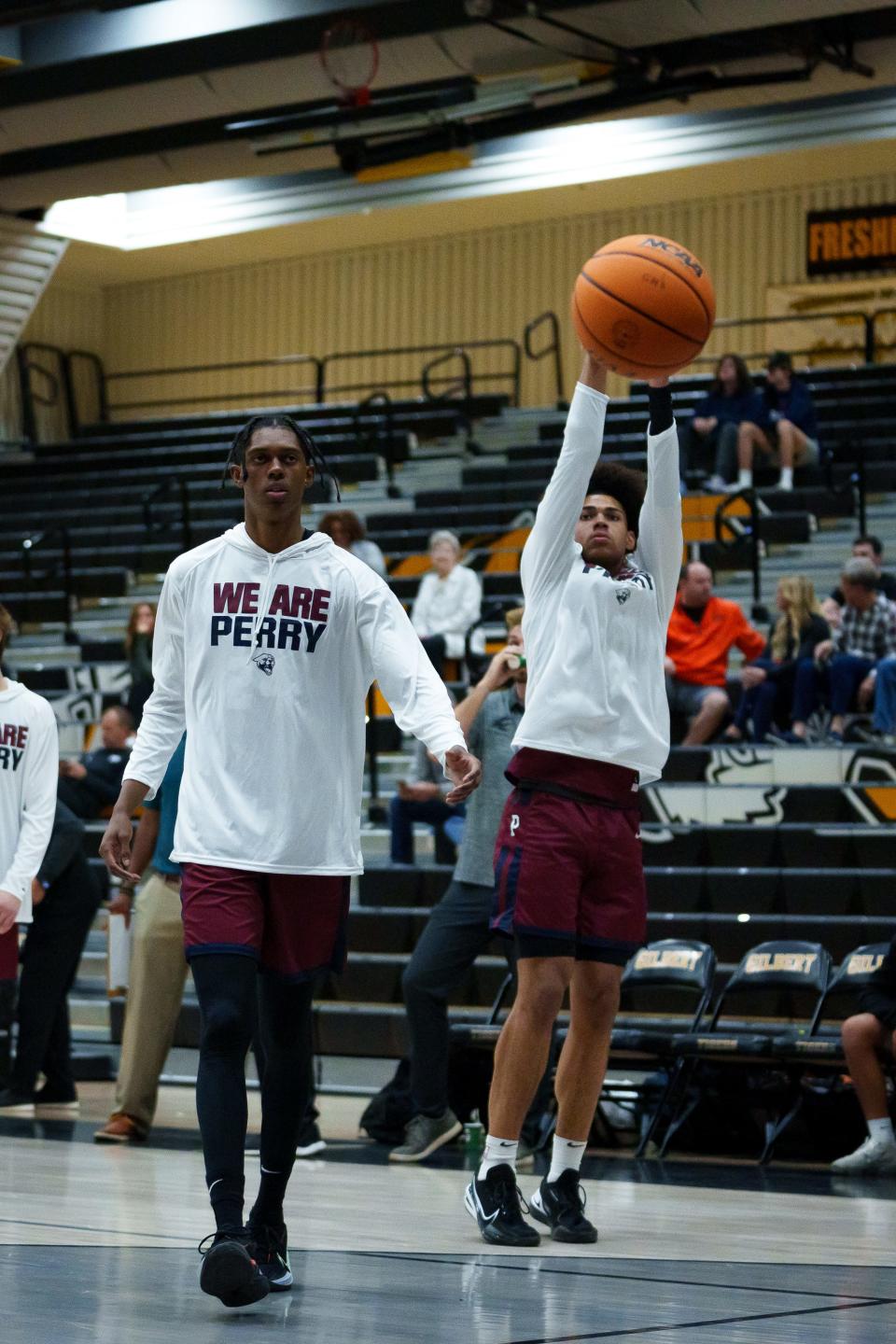 Perry's Cody Williams (left) and Koa Peat (right) warm up before the Pumas play Eastmark in the "Welcome to the Jungle Holiday Tournament" hosted at Gilbert High School on Nov. 21, 2022, in Gilbert.