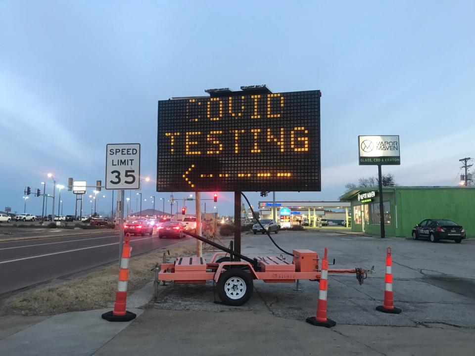 A sign directs residents to a state-sponsored COVID-19 testing site in Columbia on Jan. 25, 2022.