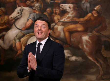 FILE PHOTO: Outgoing Italian Prime Minister Matteo Renzi gestures during the bell ceremony, to signify the start of the first cabinet meeting of the newly appointed Italian Prime Minister Paolo Gentiloni, at Chigi Palace in Rome, Italy December 12, 2016. REUTERS/Alessandro Bianchi/File Photo