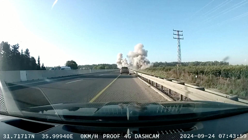 Smoke rises in a dashcam footage of a rocket falling on an Israeli highway amid cross-border hostilities between Hezbollah and Israel near Tamra, Israel September 24, 2024 in this screen grab obtained from a social media video. Social Media/via REUTERS  THIS IMAGE HAS BEEN SUPPLIED BY A THIRD PARTY. MANDATORY CREDIT. NO RESALES. NO ARCHIVES.