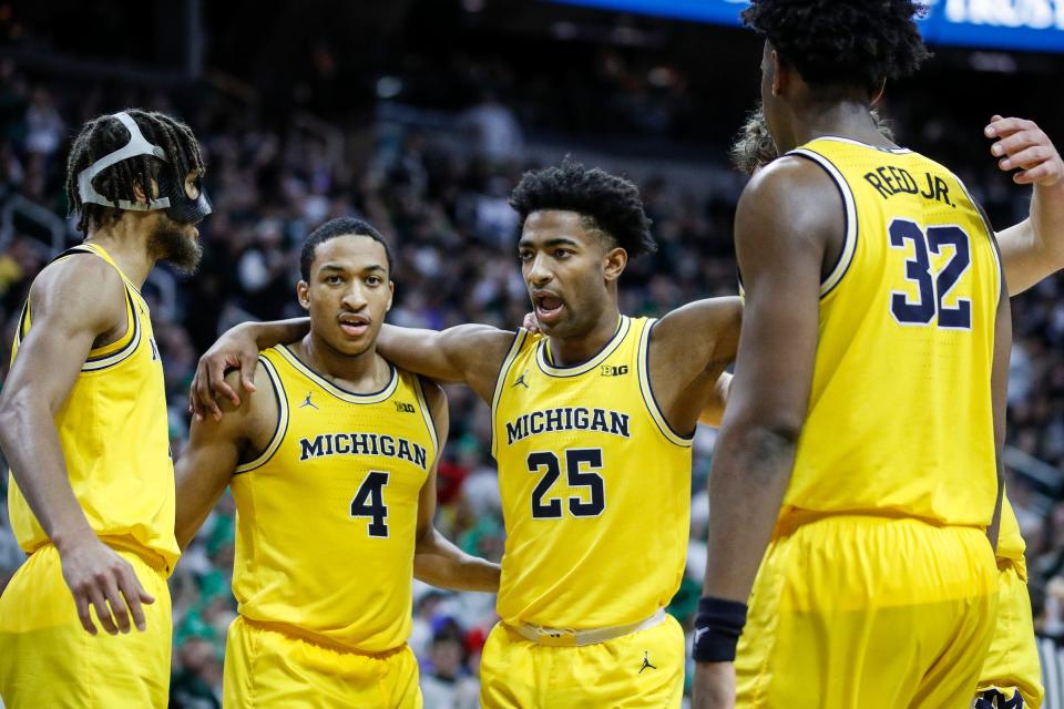 From left, Michigan forward Tray Jackson (2), guard Nimari Burnett (4), guard Jace Howard (25) and forward Tarris Reed Jr. (32) huddle after a play against Michigan State during the second half of MSU's 81-62 win over Michigan on Tuesday, Jan. 30, 2024, in East Lansing.