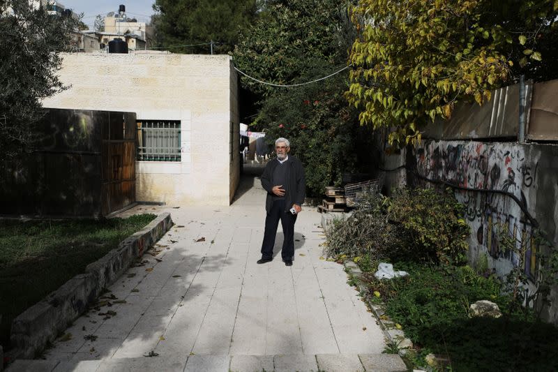 Palestinian Nabil Al-Kurd stands outside his home in east Jerusalem