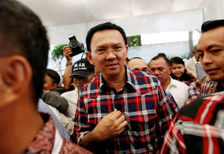 Jakarta Governor Basuki Tjahaja Purnama, nicknamed "Ahok", leaves the stage after meeting with supporters while campaigning for the upcoming election for governor in Jakarta, Indonesia November 16, 2016. REUTERS/Darren Whiteside/File Photo