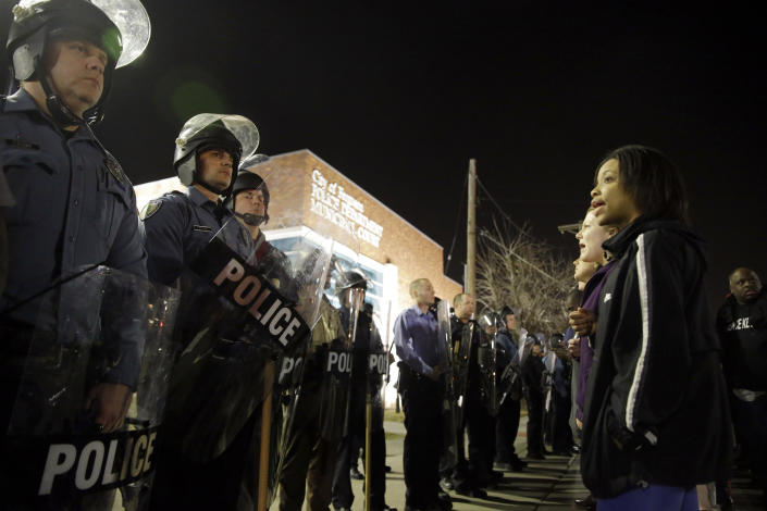 Police and protesters square off outside the Ferguson Police Department the night two officers were shot amid the demonstrations. (AP/Jeff Roberson)