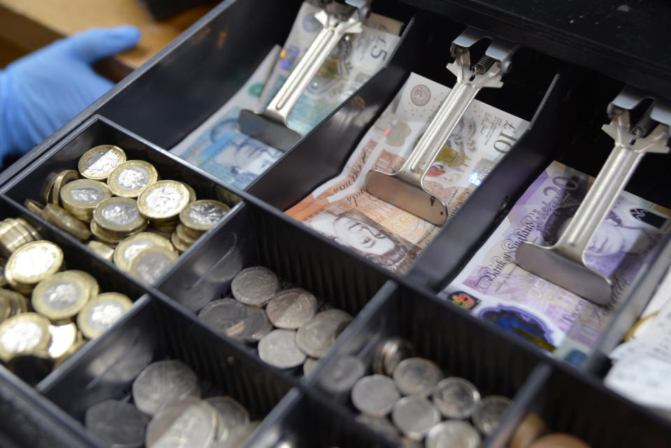 LONDON, UNITED KINGDOM - JANUARY 11: A cash counter is seen in a supermarket as the United Kingdom struggles with the highest inflation rate of the last 40 years, in the city of London, on January 11, 2023. Market coupons have started to be distributed to the people with low-income, who are having difficulties due to the increasing living costs. Vouchers issued by local governments will be valid at major supermarkets such as Tesco, Asda and Morrisons. (Photo by Gultekin Bayir/Anadolu Agency via Getty Images)