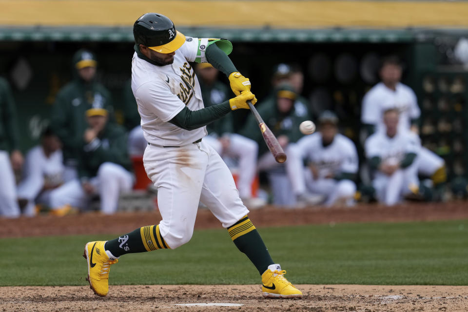 Oakland Athletics' Abraham Toro hits an RBI double against the Washington Nationals during the seventh inning of a baseball game Saturday, April 13, 2024, in Oakland, Calif. (AP Photo/Godofredo A. Vásquez)
