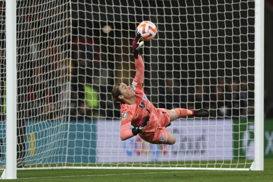 England's goalkeeper Mary Earps attempts a save during a penalty shootout at the end of the Women's Finalissima soccer match between England and Brazil at Wembley stadium in London, Thursday, April 6, 2023. (AP Photo/Ian Walton)