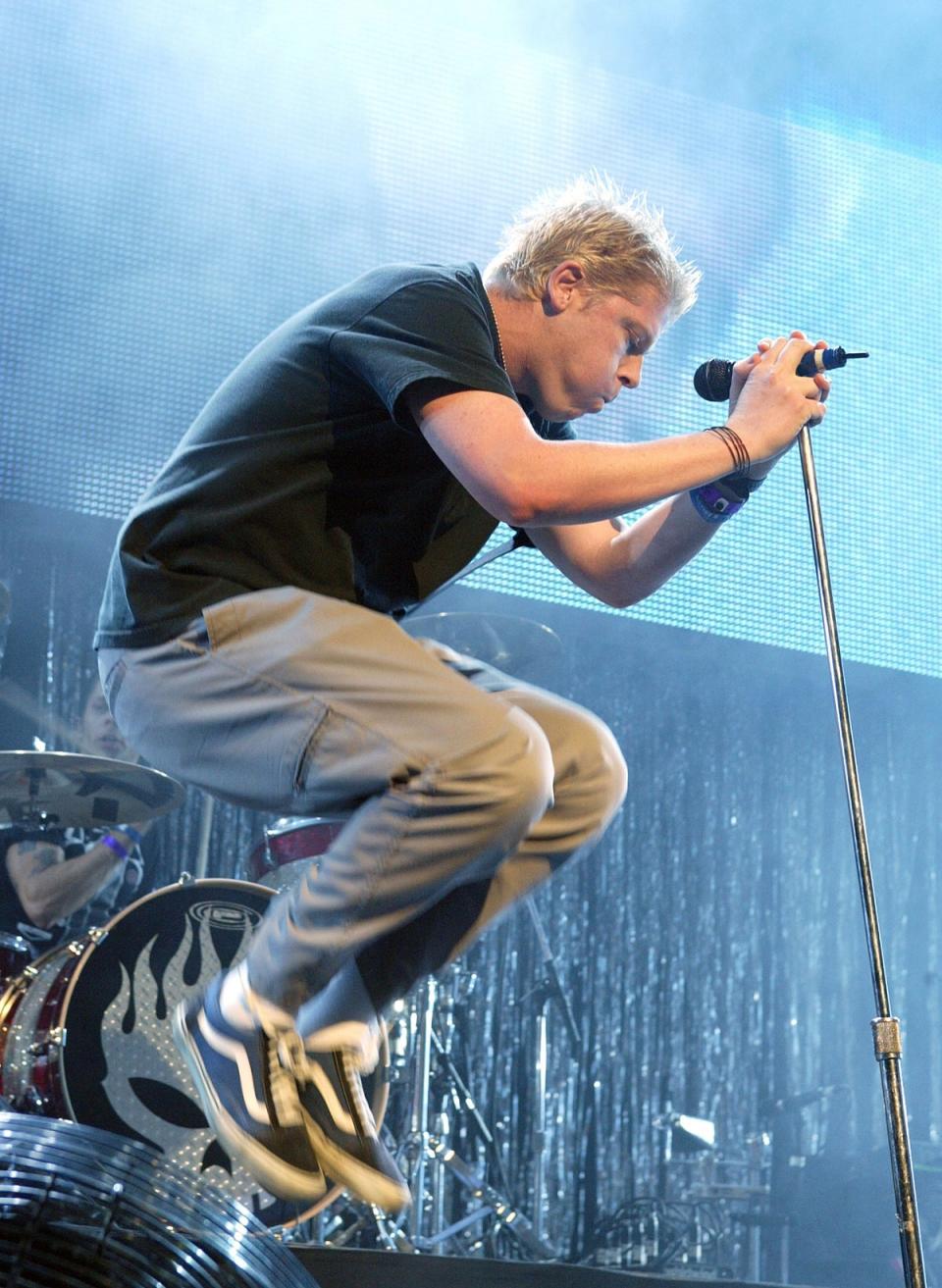 Knees up: Dexter Holland on stage with The Offspring in 2003 (Getty Images)