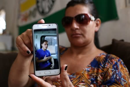 Odijane Mota shows a picture of her son during an interview with Reuters in Altamira