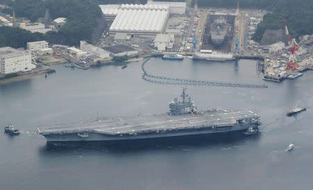 USS Ronald Reagan, a Nimitz-class nuclear-powered supercarrier, leaves from its home port to be deployed in waters near Japan, in Yokosuka, south of Tokyo, Japan, in this photo taken by Kyodo May 16, 2017. Mandatory credit Kyodo/via REUTERS