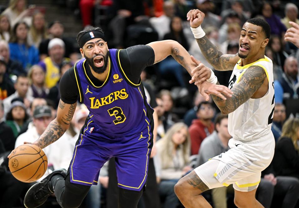 Los Angeles Lakers forward Anthony Davis (3) tries to get past Utah Jazz forward John Collins (20) as Utah and Los Angeles play at the Delta Center in Salt Lake City on Saturday, Jan. 13, 2024. Utah won 132-125. | Scott G Winterton, Deseret News