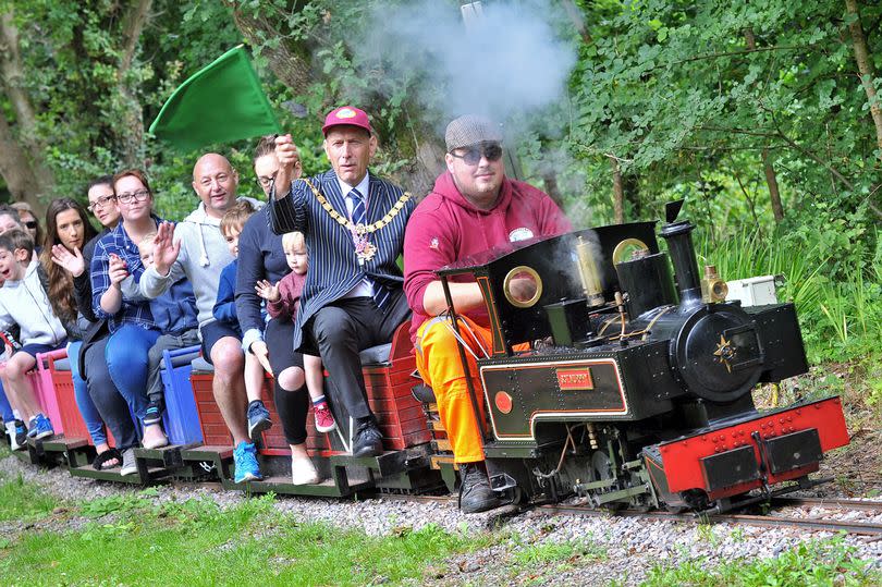 Mizens Railway, Barrs Lane, Knaphill - Mayor of Woking cllr. Graham Cundy waves off a train loaded with children and parents enjoying themselves at the Rotary Club of Woking Mizens Day out. Engine driver Tom Coombs.  The engine itself is called Sgt. Murphy.