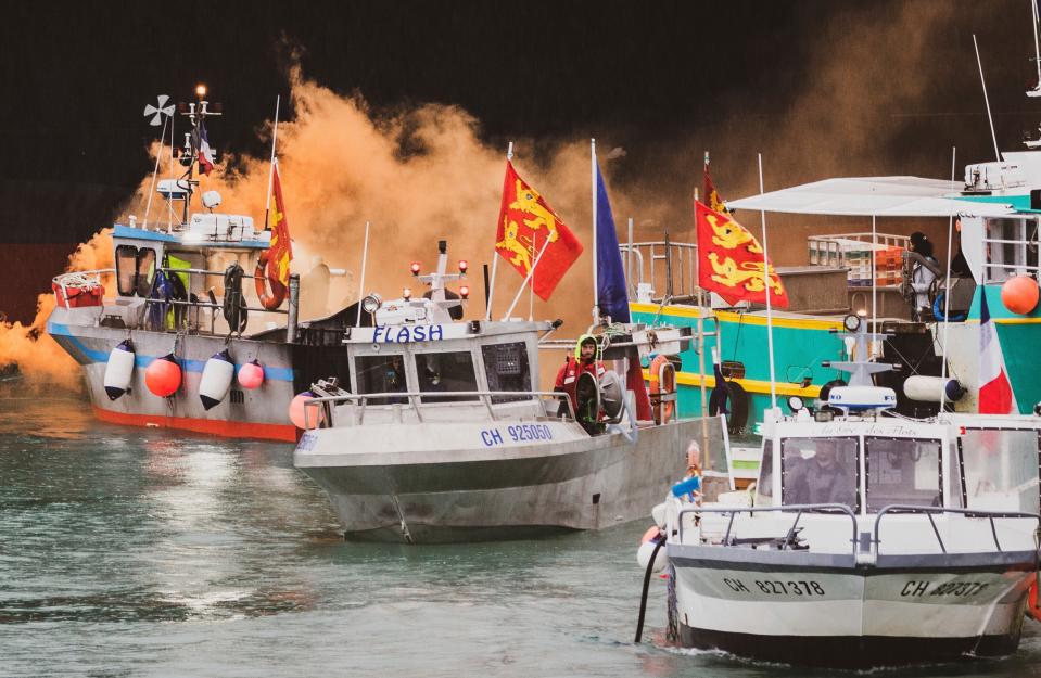 <p>French fishing vessels at sea off the coast of Jersey during a protest last week</p> (AP)