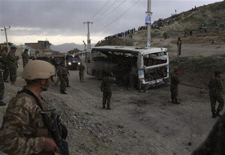 Afghan National Army soldiers (ANA) investigate the site of a suicide attack in Kabul May 26, 2014. REUTERS/Omar Sobhani