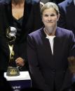 United States coach Jill Ellis stands next to the World Cup trophy, during the women's soccer World Cup France 2019 draw, in Boulogne-Billancourt, outside Paris, Saturday, Dec. 8, 2018. (AP Photo/Christophe Ena)