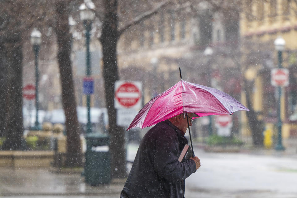 Bruce Rowlison, of Los Gatos, walks downtown in Santa Cruz, Calif., Thursday, Feb. 1, 2024. (AP Photo/Nic Coury)