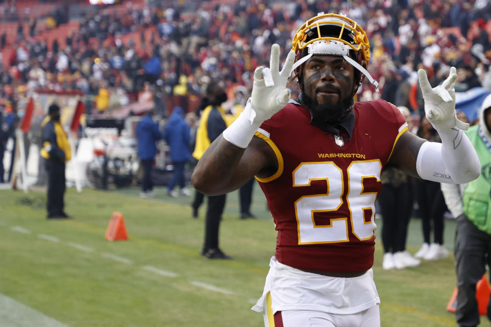 Washington Football Team safety Landon Collins (26) celebrates while leaving the field after the game against the Tampa Bay Buccaneers at FedExField. Mandatory Credit: Geoff Burke-USA TODAY Sports