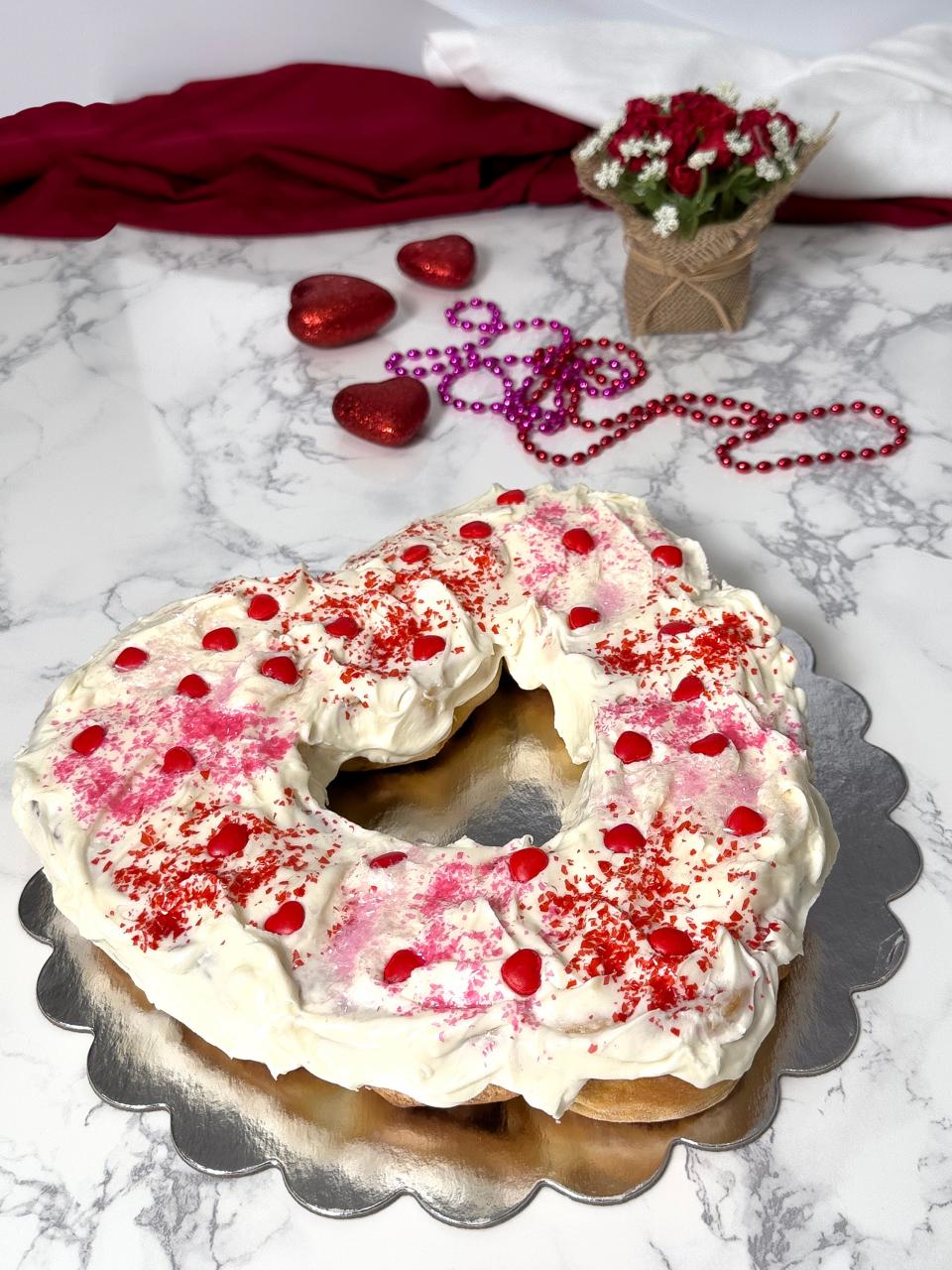 Sweetheart King Cakes forms traditional Mardi Gras king cake into a heart shape for a festive touch to Valentine’s Day sweets.