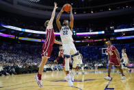 Villanova's Cam Whitmore, right, goes up for a shot against Oklahoma's Jacob Groves during the first half of an NCAA college basketball game, Saturday, Dec. 3, 2022, in Philadelphia. (AP Photo/Matt Slocum)