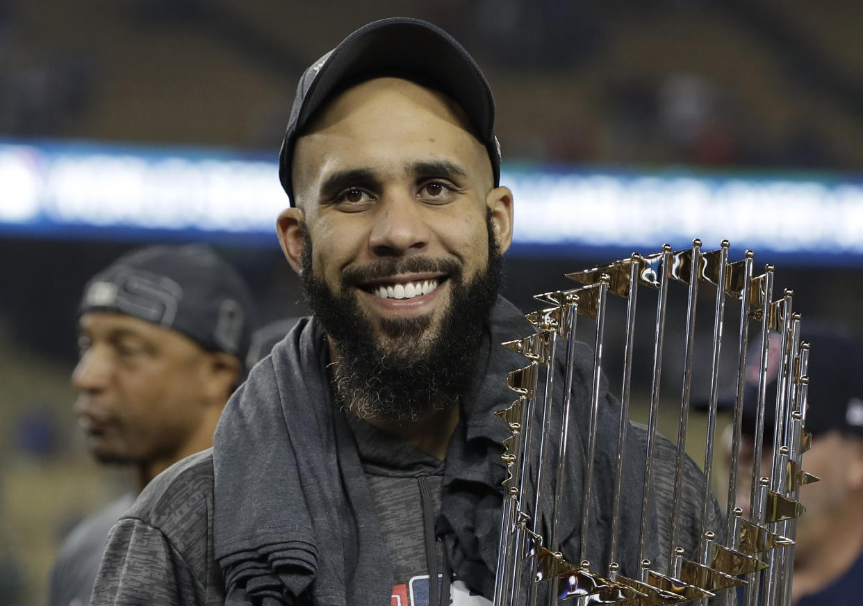 Boston Red Sox pitcher David Price holds the championship trophy after Game 5 of baseball’s World Series against the Los Angeles Dodgers on Oct. 28, 2018, in Los Angeles. The Red Sox won 5-1 to win the series 4-1. (AP Photo/David J. Phillip)
