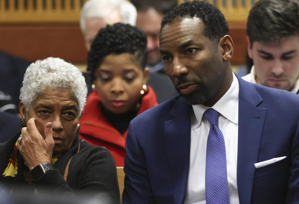 Former Atlanta Mayor Shirley Franklin, left, and current Atlanta Mayor Andre Dickens chat as they sit in the gallery during a hearing on the Georgia election interference case, Friday, Feb. 16, 2024, in Atlanta. The hearing is to determine whether Fulton County District Attorney Fani Willis should be removed from the case because of a relationship with Nathan Wade, special prosecutor she hired in the election interference case against former President Donald Trump. (Alyssa Pointer/Pool Photo via AP)