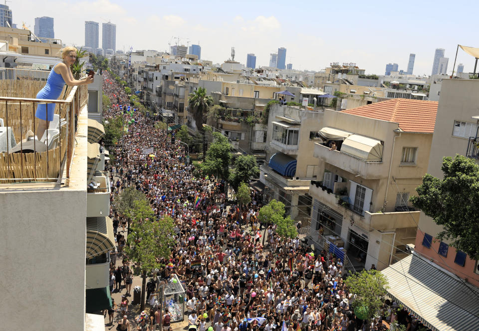 People take part in annual Gay Pride parade in Tel Aviv, Israel, Friday, June 14, 2019.(AP Photo/Tsafrir Abayov)