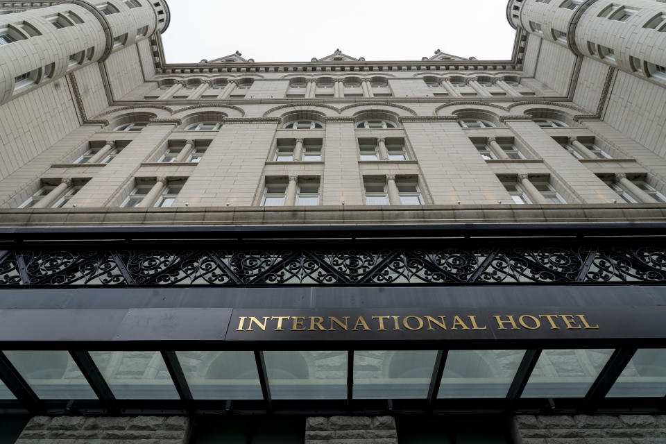 FILE - The Old Post Office building is seen with covered signage for Trump, May 12, 2022, in Washington. Records show over the past two years, Axos Bank, as well as its largest individual shareholder Don Hankey, have extended more than $500 million in financing that has benefited Trump, helping him to pay off debts and pocket a tidy profit while escaping from a lease on the money-losing former hotel in Washington. Ethics experts say they could also grant Hankey and Axos Bank outsize sway in a future Trump administration. (AP Photo/Gemunu Amarasinghe, File)