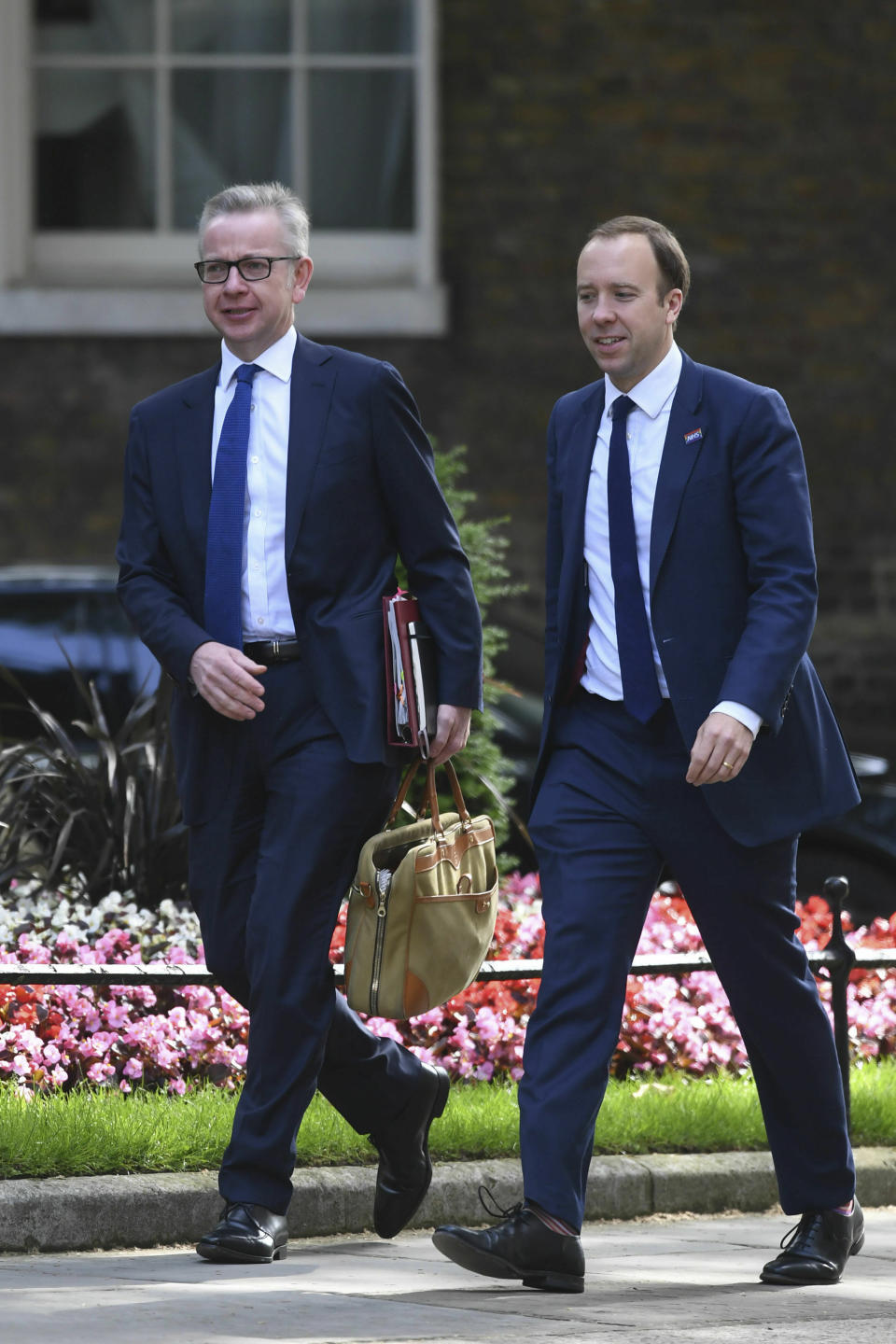 Britain's Environment Secretary Michael Gove, left, and Health Secretary Matt Hancock arrive for a cabinet meeting at 10 Downing Street, London, Tuesday June 18, 2019. (Stefan Rousseau/PA via AP)