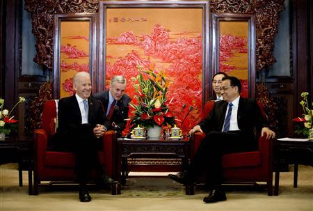 U.S. Vice President Joe Biden (L) chats with Chinese Premier Li Keqiang during their meeting at the Zhongnanhai diplomatic compound in Beijing December 5, 2013. REUTERS/AP Photo/Andy Wong/Pool